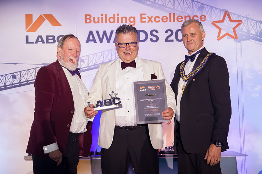 Winner on stage at the LABC West Midlands Building Excellence Awards 2019